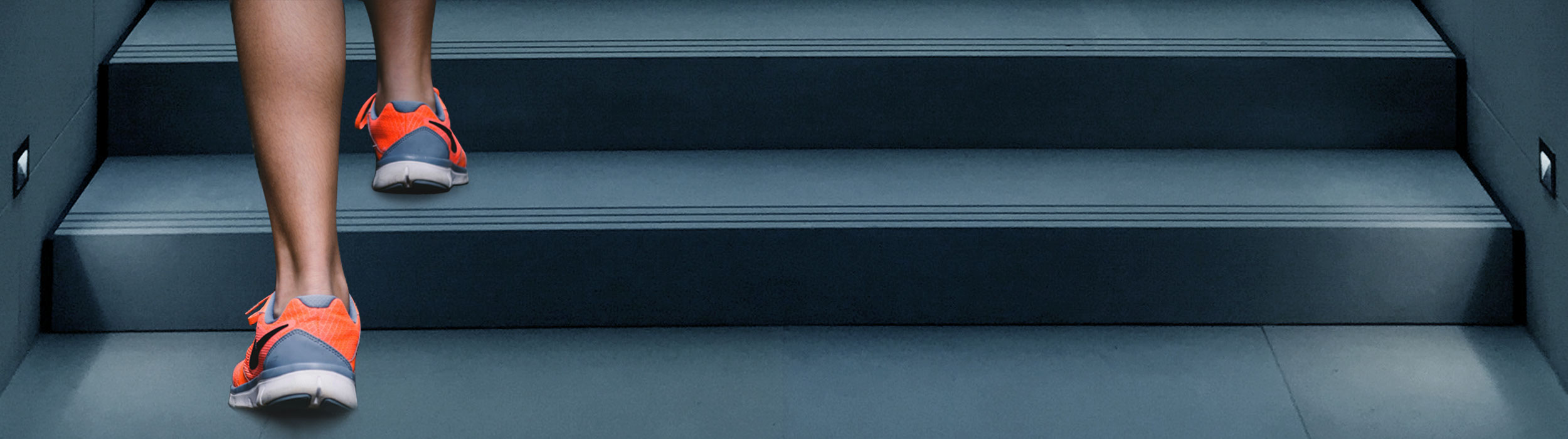 Closeup on ankle while a woman goes up stairs